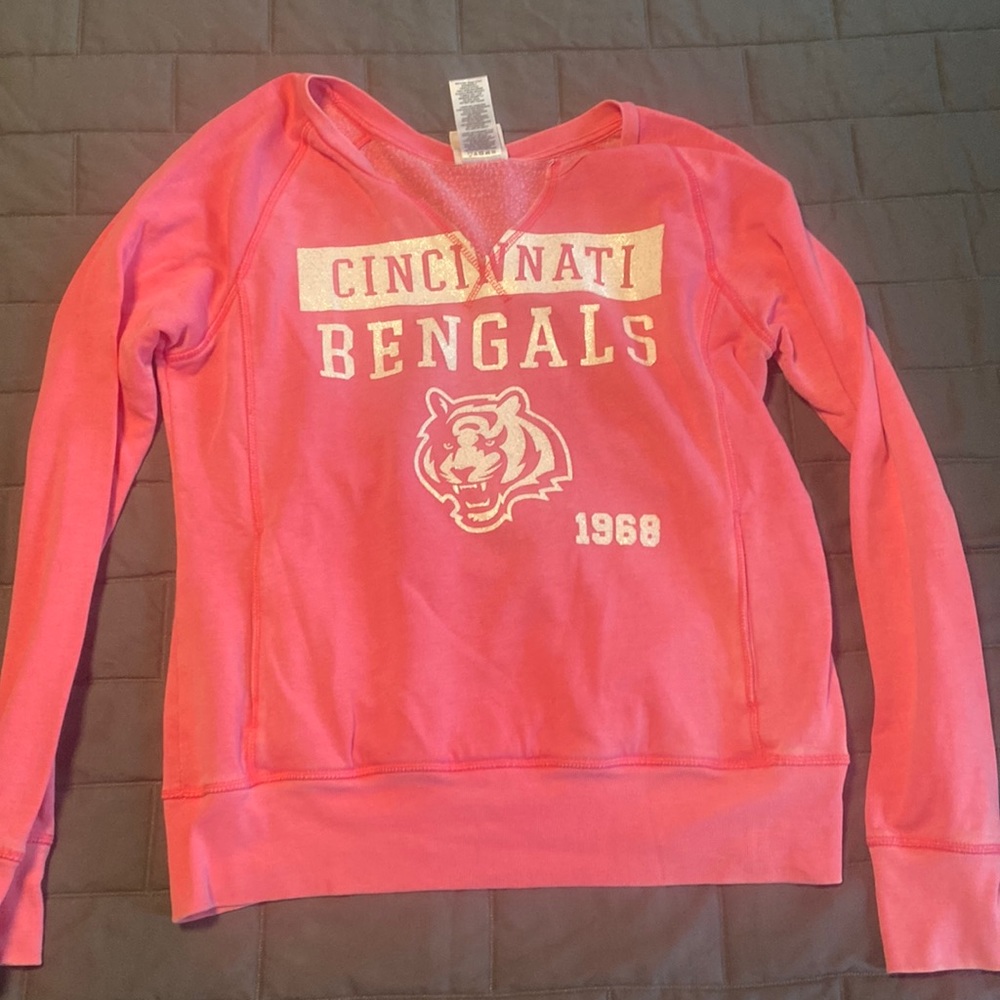 Like new Pink and white Bengals sweatshirt. White areas= silver glitter sparkle